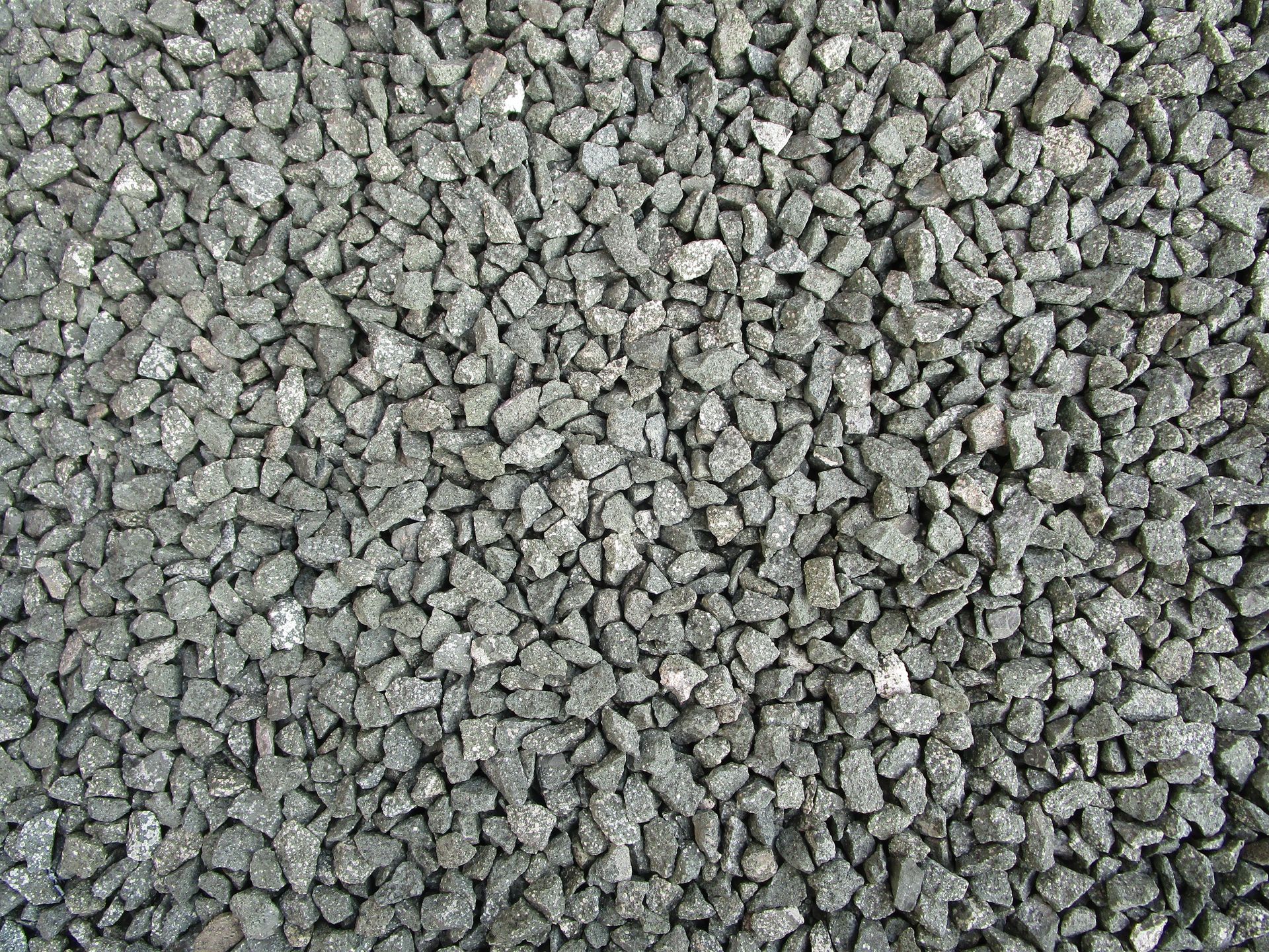 Detailed view of grey gravel stones commonly used in construction and landscaping.