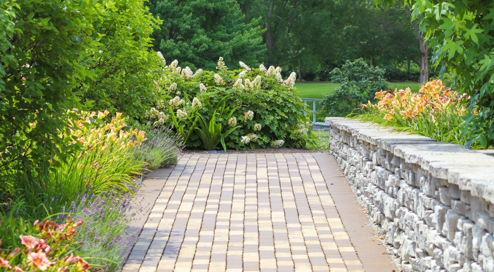 A serene garden path with vibrant flowers and lush greenery, perfect for relaxation.